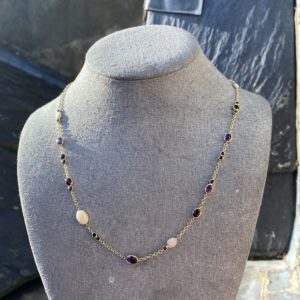 Spectacle set multi gemstone necklace made up from ten different rings