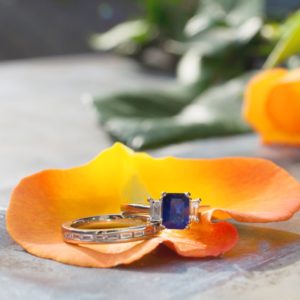 Sapphire and diamond engagement ring with baguette diamond wedding ring