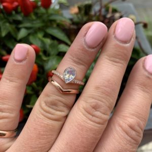 Rose gold, moonstone and diamond ring with fitted wedding ring