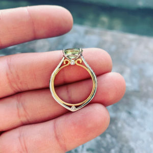 Green sapphire and diamond ring with rose gold in lay