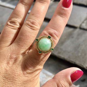 Jade and emerald dress ring in yellow gold