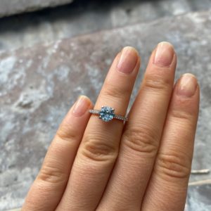 Aquamarine and diamond solitaire with rose gold in lay