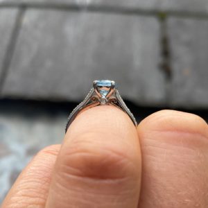 Aquamarine and diamond solitaire with rose gold in lay