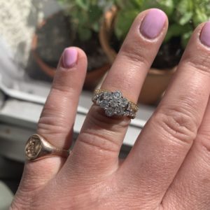 Diamond cluster engagement ring with matching diamond set wedding ring