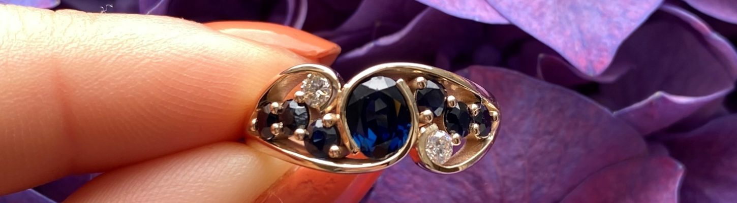 Sapphire and diamond crossover dress ring remodelled from clients Mother's and Mother in Law's engagement rings