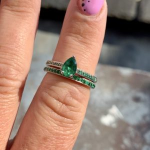 Emerald engagement ring with matching emerald wedding ring