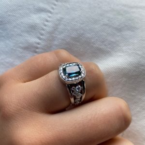 Teal sapphire and diamond halo split shoulder dress ring