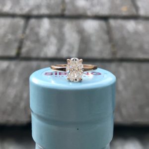 Oval diamond solitaire set in rose gold