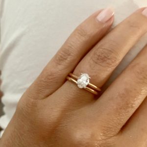 Oval and rose gold solitaire with matching rose gold wedding ring