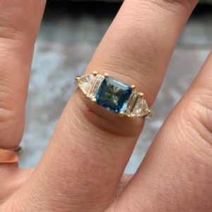 Aquamarine, bagutte and trillaint diamond five gemstone ring
